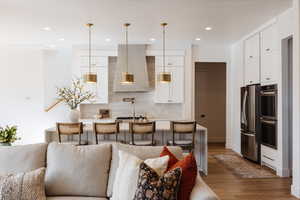 Living room with hardwood / wood-style flooring