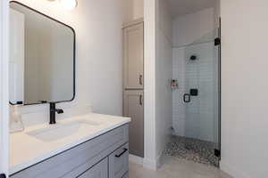 Bathroom with vanity and walk in shower