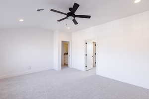 Unfurnished room featuring ceiling fan and light carpet