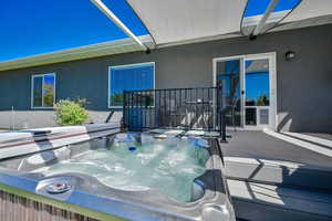 Exterior space featuring an outdoor hot tub