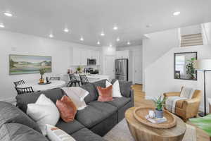 Living room with light hardwood / wood-style flooring