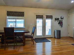 Dining area with hardwood / wood-style floors