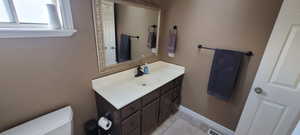 Bathroom with vanity and toilet