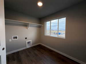 Washroom featuring dark hardwood / wood-style flooring, hookup for a washing machine, and hookup for an electric dryer