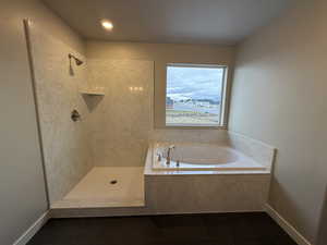 Bathroom featuring tile patterned floors and independent shower and bath