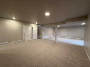 Basement with carpet flooring