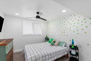 Carpeted bedroom with ceiling fan