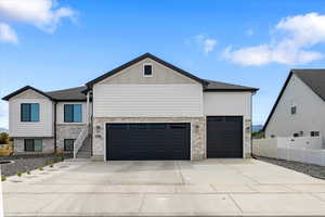 View of front facade featuring a garage