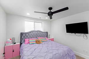 Bedroom featuring carpet and ceiling fan