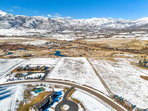 Snowy aerial view featuring a mountain view