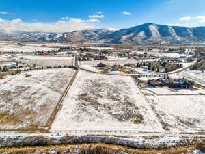 Snowy aerial view featuring a mountain view