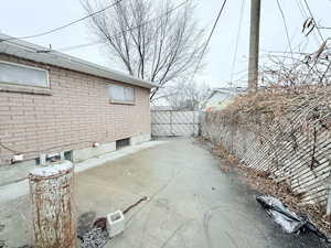 View of side of property featuring a patio