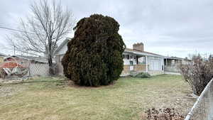 View of yard with a porch