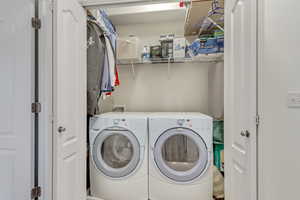 Laundry area with washer and clothes dryer