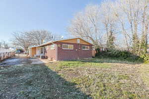 View of property exterior with a lawn