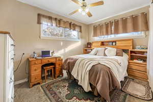 Bedroom featuring ceiling fan and light colored carpet