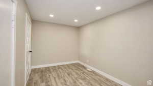 Unfurnished room with light hardwood / wood-style floors