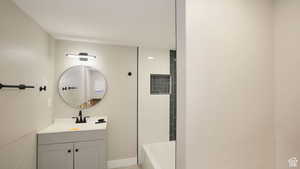 Bathroom with a tub to relax in and vanity