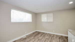 Spare room with light hardwood / wood-style floors