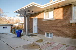 West side property entrance featuring a mountain view