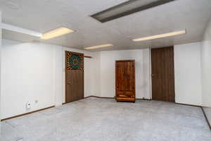 Unfurnished room featuring light colored carpet