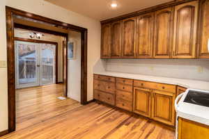 Kitchen featuring stove and light hardwood / wood-style floors