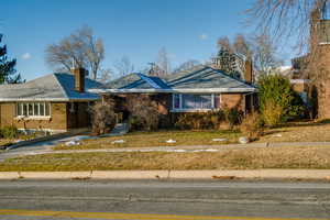 Bungalow style house with a front yard