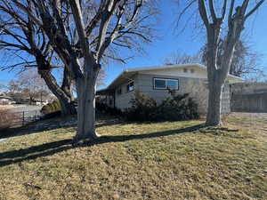 View of home's exterior with a lawn