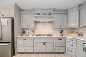 Kitchen with custom exhaust hood