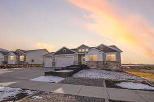 Craftsman inspired home with a 3 car garage