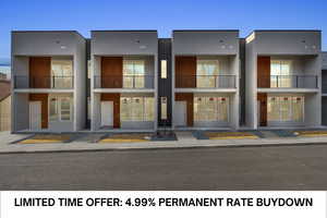 View of front facade featuring stucco siding