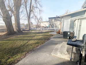 View of yard featuring central AC unit