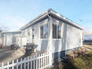 View of property exterior with a patio and central AC