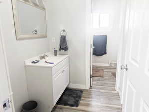 Bathroom featuring hardwood / wood-style floors and vanity