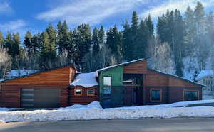 View of front of home featuring a garage