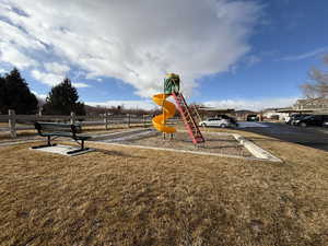 View of play area with a lawn