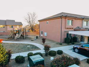 View of side of home with a playground