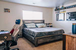 Bedroom with light carpet