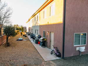 View of property exterior featuring a patio and central AC unit