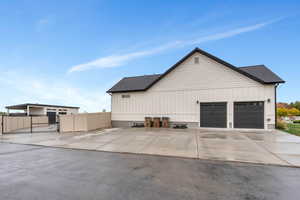 View of side of home featuring a garage