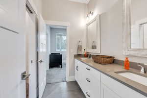 Bathroom featuring tile patterned floors and vanity