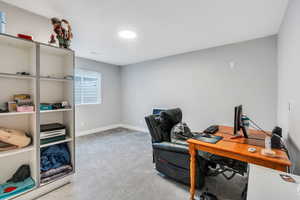 Home office featuring carpet flooring