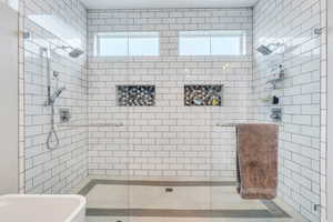 Bathroom featuring a shower with shower door