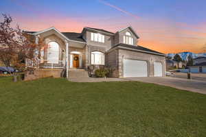 View of front of property featuring a yard