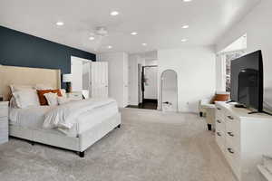 Bedroom featuring ceiling fan and light carpet