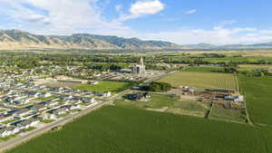 Birds eye view of property featuring a mountain view and a rural view