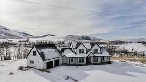 Tudor-style house with a mountain view and a garage