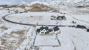 Snowy aerial view featuring a mountain view