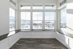 Unfurnished sunroom with a mountain view