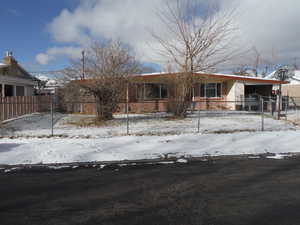 View of front facade featuring a garage